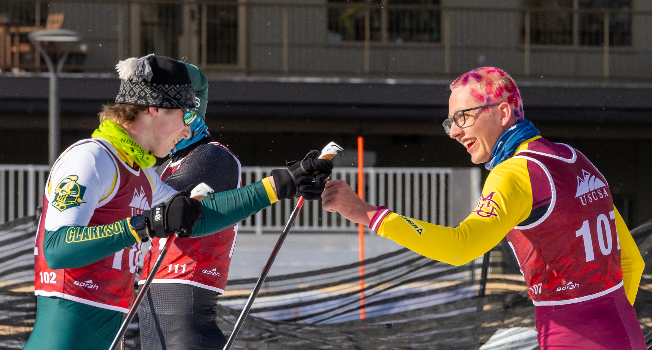 Respect across the finish — competitors sharing a moment after the effort, the kind of racing that brings out the best in everyone.